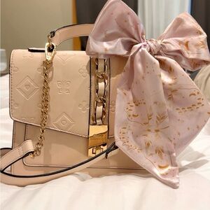 Elegant Beige Handbag with Pink Bow